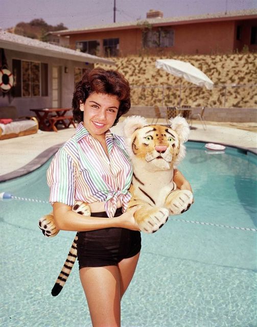 Annette Funicello holding a tiger cub.... 6
