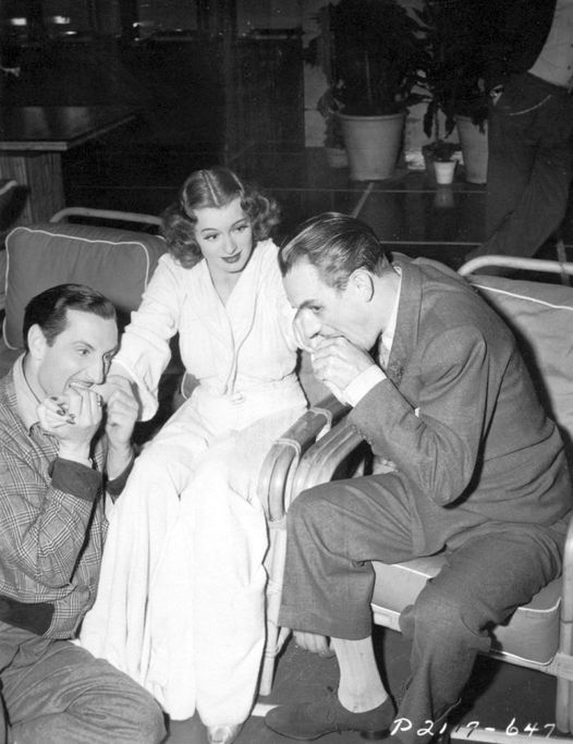Basil Rathbone and Boris Karloff having a little bite to eat with Ellen Drew....