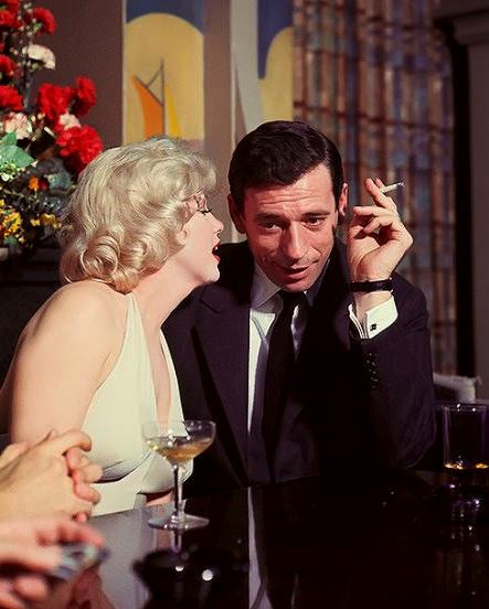 Marilyn Monroe and Yves Montand at a press conference for Let’s Make Love, 1960....